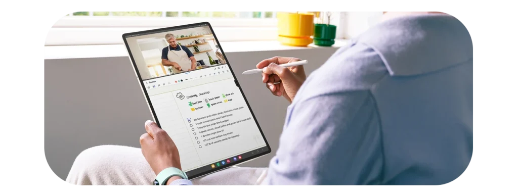 Woman uses Samsung Galaxy Tab S9 5G to take notes whilst learning a new recipe